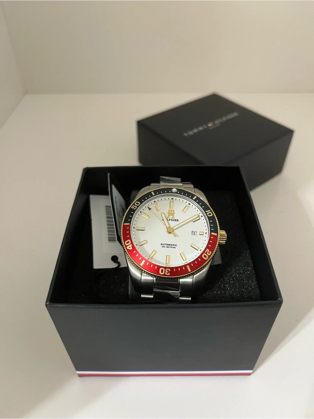 Tommy Hilfiger Silver Dial Men’s Watch with Red and Black Bezel